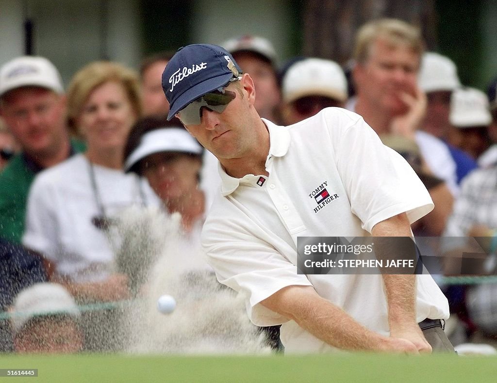 David Duval of the US chips onto the sixth green a