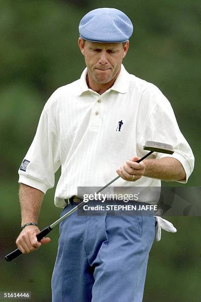 Payne Stewart of the US reacts after his putt on the eighth green at Pinehurst No. 2 during the third round of the US Open Championship 19 June, 1999...