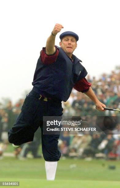 Payne Stewart of the US reacts to sinking his putt on the eighteenth green at Pinehurst No. 2 during the final round of the US Open Championship 20...