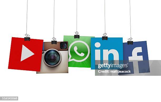 social media icons hanging on strings - youtube advertising stock pictures, royalty-free photos & images
