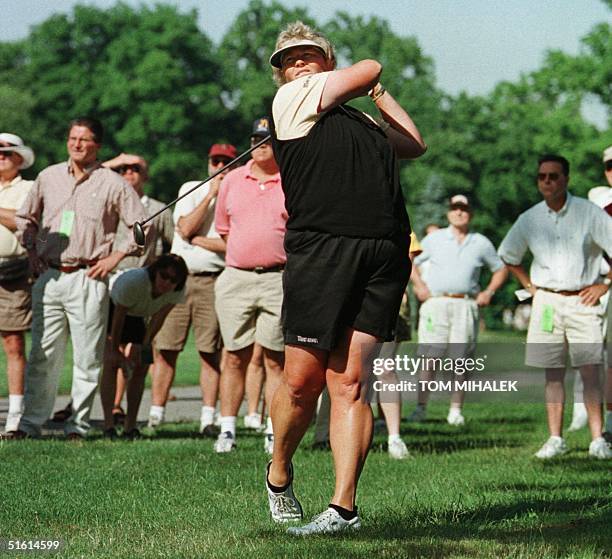 Britain's Laura Davies makes an approach shot from the rough off of the 11th fairway in the first round of play in the LPGA Championship at the...