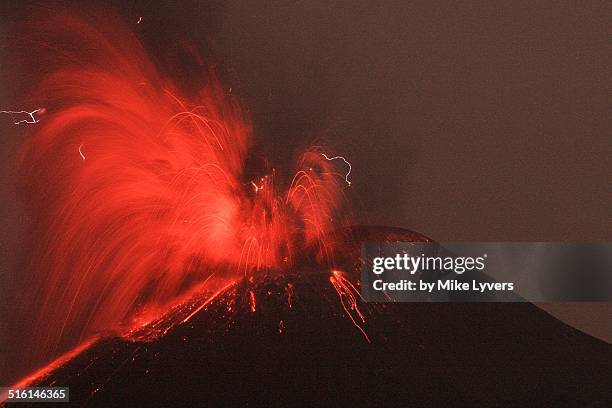 large night eruption of krakatoa - anak krakatau stock-fotos und bilder