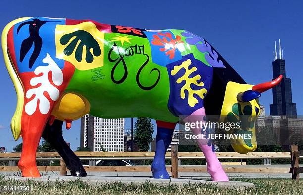 The "Jazz Cow" is one of the 300 life-size painted and sculpted Fiberglas cows on display 29 June as part of the "Cows on Parade" in Chicago,...