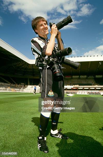 Peter Beardsley pictured with photographers cameras in a set up picture as Beardsley returns to Newcastle United for his second spell with the club...