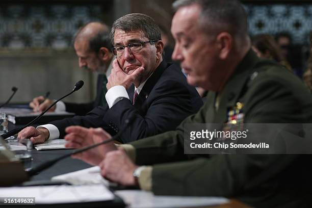 Defense Secretary Ashton Carter listens to Chairman of the Joint Chiefs of Staff Gen. Joseph Dunford Jr. Testify about the Pentagon budget before the...