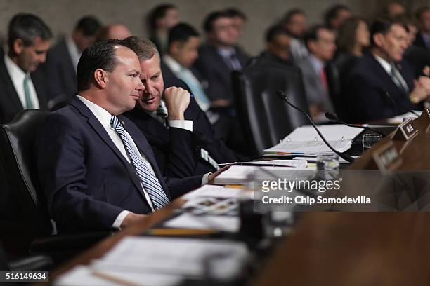 Senate Armed Services Committee members Sen. Mike Lee and Sen. Dan Sullivan talk during a hearing about the Pentagon budget in the Dirksen Senate...