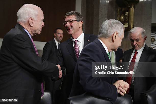 Secretary of Defense Ashton Carter greets Senate Armed Services Committee Chairman John McCain before a hearing about the Pentagon budget with...