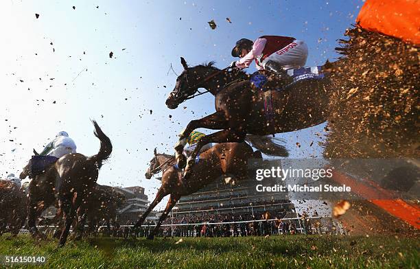 Noel Fehily on Our Kaempfer clears a jump in the Pertemps Network Final on day three, St Patrick's Thursday, of the Cheltenham Festival at Cheltenham...