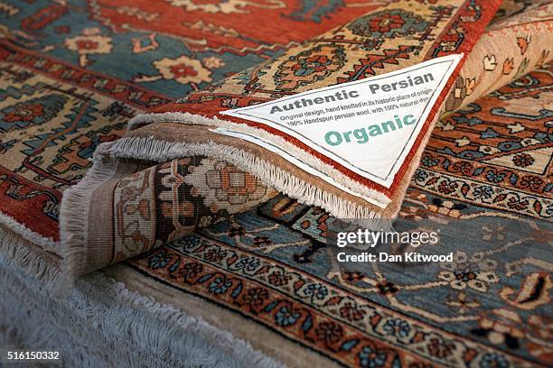 Persian rugs with reproductions of original antique designs are displayed at the Oriental Rug Centre's main warehouse on March 17, 2016 in London,...