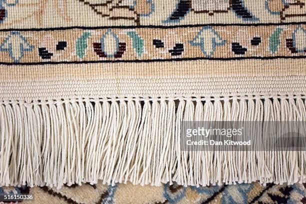 Detail of the reverse of a Persian 'Nain' rug at the Oriental Rug Centre's main warehouse on March 17, 2016 in London, England. The Oriental Rug...