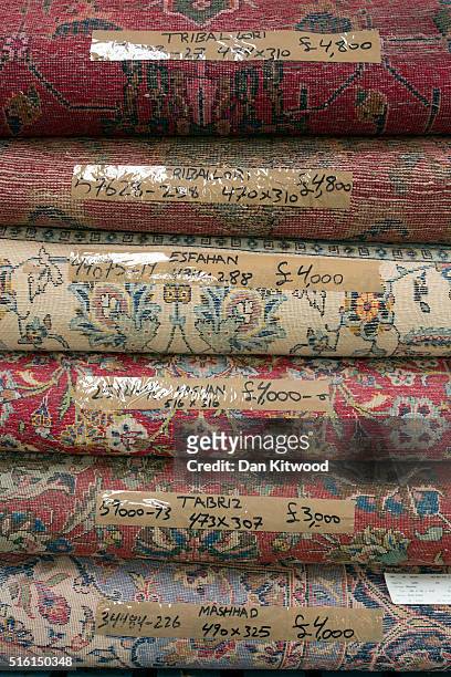 Selection of Persian rugs are piled at the Oriental Rug Centre's main warehouse on March 17, 2016 in London, England. The Oriental Rug Centre in...