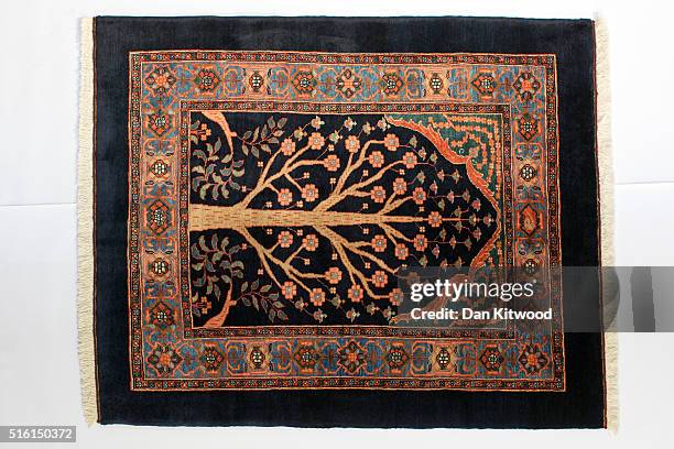 Persian 'Sarouk' rug is displayed at the Oriental Rug Centre's main warehouse on March 17, 2016 in London, England. The Oriental Rug Centre in North...