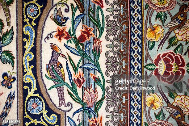 Persian 'Isfahan' rug is displayed at the Oriental Rug Centre's main warehouse on March 17, 2016 in London, England. The Oriental Rug Centre in North...