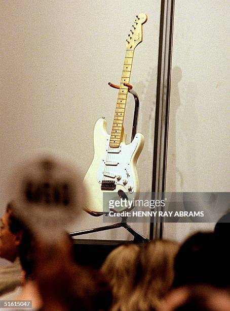 Bidder raises his paddle on Lot 35, a 1994 Fender Stratocaster Eric Clapton Signature Model, which Clapton used on stage in the mid-90's and for...