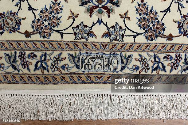 Detail of the signature of the founder of a 'Nain' Persian rug at the Oriental Rug Centre's main warehouse on March 17, 2016 in London, England. The...