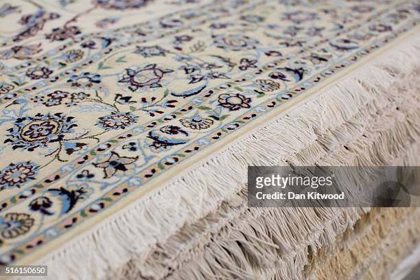 Persian 'Nain' rug is displayed at the Oriental Rug Centre's main warehouse on March 17, 2016 in London, England. The Oriental Rug Centre in North...