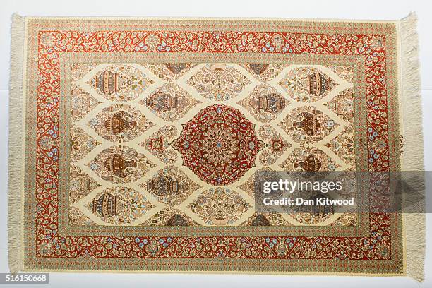 Persian 'Qom' rug is displayed at the Oriental Rug Centre's main warehouse on March 17, 2016 in London, England. The Oriental Rug Centre in North...