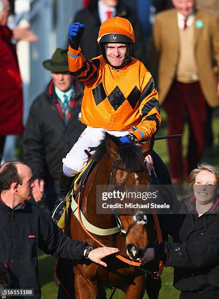 Tom Scudamore celebrates as he rides Thistlecrack to victory in the Ryanair World Hurdle on day three, St Patrick's Thursday, of the Cheltenham...