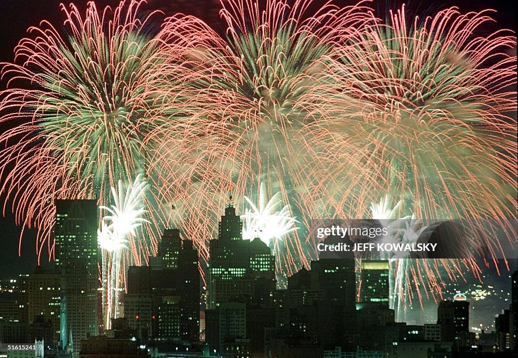 Fireworks fired from barges on the Detroit River a