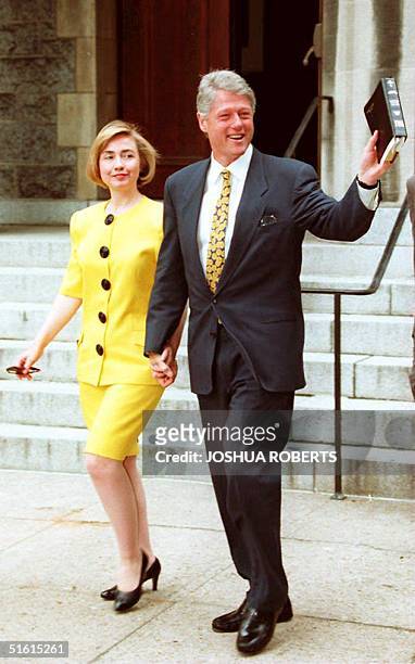 President Bill Clinton and First Lady Hillary wave to reporters as they leave United Foundry Methodist Church 12 June 1994. Clinton is due to receive...
