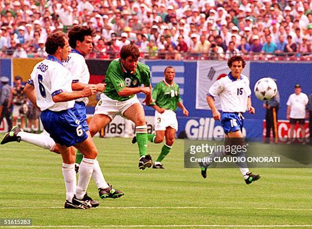 Ireland's Ray Houghton watches his shot go in the goal 18 June, 1994 during the first half of the game against Italy. Houghton scored and gave...