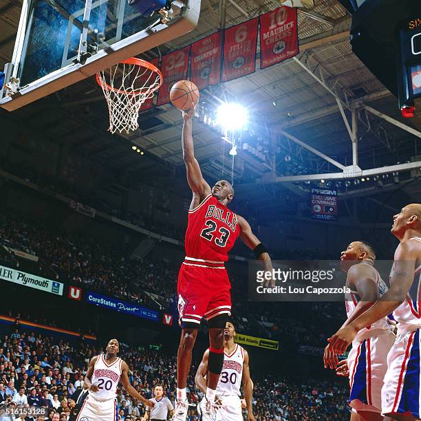 Michael Jordan of the Chicago Bulls dunks against the Philadelphia 76ers on March 18, 1996 at the Spectrum in Philadelphia, Pennsylvania. NOTE TO...