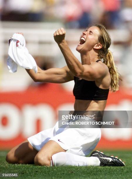 Brandi Chastain of the US celebrates after kicking the winning penalty shot to win the 1999 Women's World Cup final against China 10 July 1999 at the...
