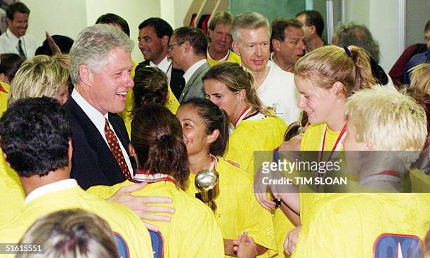 President Bill Clinton greets the US team in the locker room after they defeated China in a penalty kick shoot-out to win the 1999 Women's World Cup...