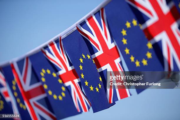 In this photo illustration, the European Union and the Union flag sit together on bunting on March 17, 2016 in Knutsford, United Kingdom. The United...