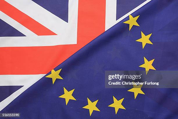 In this photo illustration, the European Union and the Union flag sit together on March 17, 2016 in Knutsford, United Kingdom. The United Kingdom...