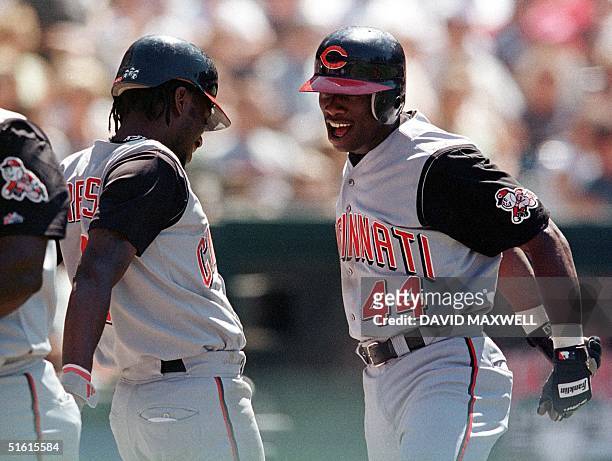 Cincinnati Reds center fielder Mike Cameron celebrates with teammate Pokey Reese following his eighth inning two run home run off of Cleveland...