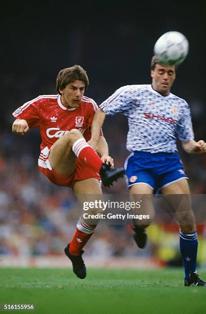 Liverpool striker Peter Beardsley outpaces United defender Mal Donaghy to score his third and Liverpool's fourth goal during the First Division match...