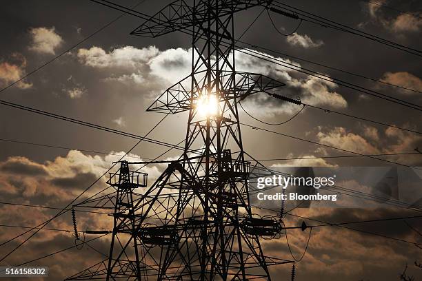 Power transmission lines hang from electricity pylons near Uskmouth power station, operated by Simec Uskmouth Power Ltd., in Newport, U.K., on...