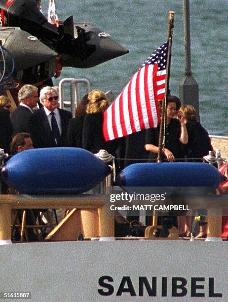 Members of the Kennedy and Bessette families including Senator Ted Kennedy gather at the stern of the Coast Guard ship Sanibel as they prepare to...