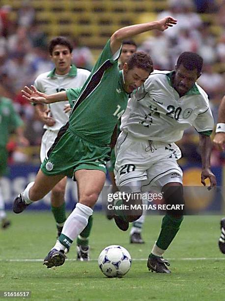 Hazem Emam of Egypt fights for the ball with Mohsin Harthi of Saudi Arabia 29 July 1999, during Confederation Cup soccer in Mexico City. AFP...