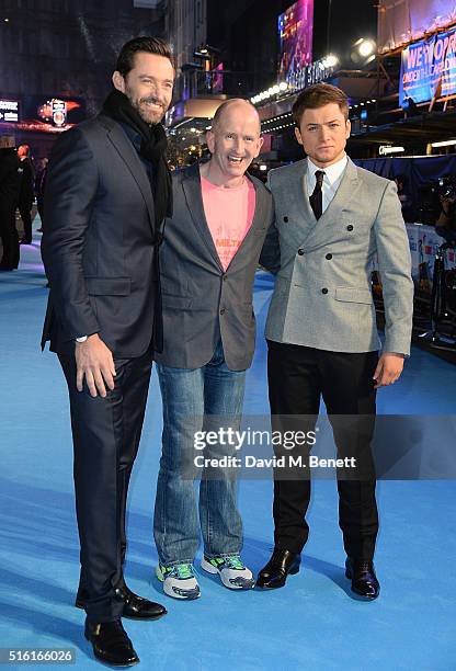 Hugh Jackman, Eddie Edwards and Taron Egerton attend the European Premiere of "Eddie The Eagle" at Odeon Leicester Square on March 17, 2016 in...