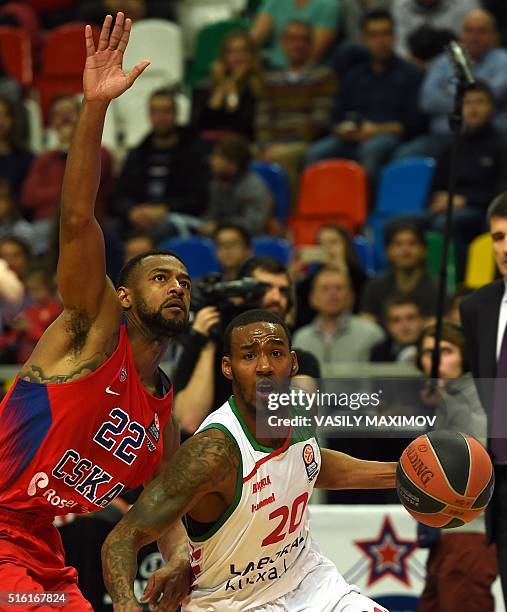 Laboral Kutxa's Darius Adams vies with CSKA Moscow's Cory Higgins during the Euroleague group F Top 16 round 11 basketball match CSKA Moscow vs...