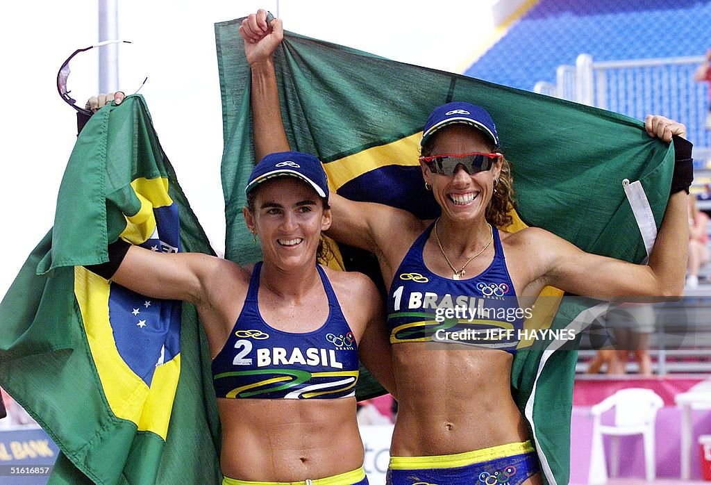 Shelda Brazilian beach volleyball pair Shelda Bede and Adriana Behar hold ...