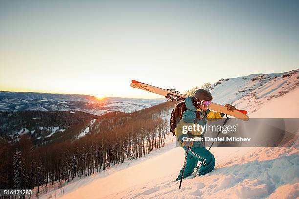 guy with skis hiking during sunset in colorado. - colorado skiing stock pictures, royalty-free photos & images