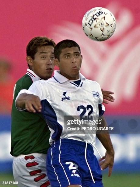 Noel Valladares of Honduras and Ignacio Hierro of Mexico eye the ball during their gold medal Pan Am Games soccer final 07 August 1999 in Winnipeg....