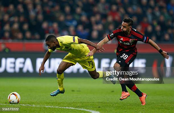 Cedric Bakambu of Villarreal and Karim Bellarabi of Bayer Leverkusen battle for the ball during the UEFA Europa League round of 16, second leg match...