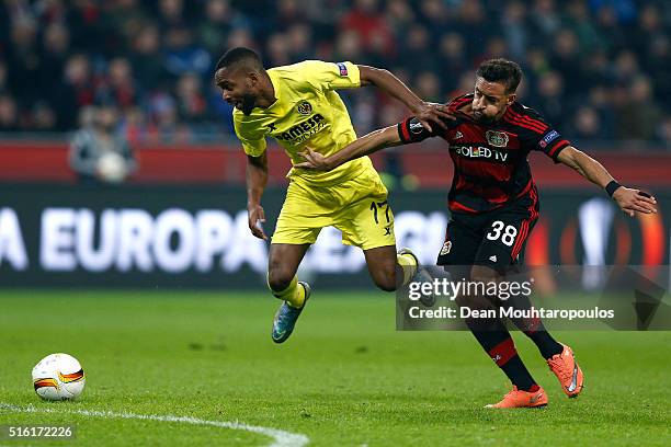 Cedric Bakambu of Villarreal and Karim Bellarabi of Bayer Leverkusen battle for the ball during the UEFA Europa League round of 16, second leg match...