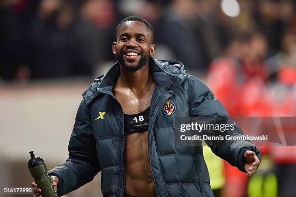 Cedric Bakambu of Villarreal celebrates an aggregate victory after the UEFA Europa League round of 16, second leg match between Bayer Leverkusen and...