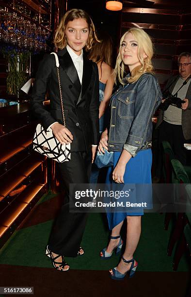 Arizona Muse and Camille Seydoux attend a dinner hosted by Roger Vivier to celebrate the Prismick Denim collection by Camille Seydoux at Casa Cruz on...
