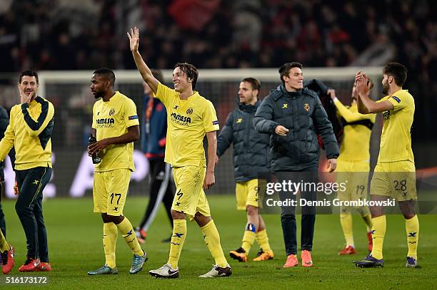 Tomas Pina of Villarreal celebrates an aggregate victory with team mates after the UEFA Europa League round of 16, second leg match between Bayer...