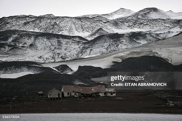 An old building of the Hector Whaling Company crumbles at Whalers Bay in Deception Island, in the western Antarctica peninsula on March 06, 2016. In...