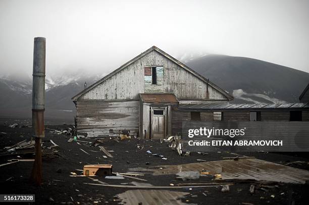 An old building of a British shipping base, which was consumed by a mudslide sparked by a volcano, crumbles at Whalers Bay in Deception Island, in...