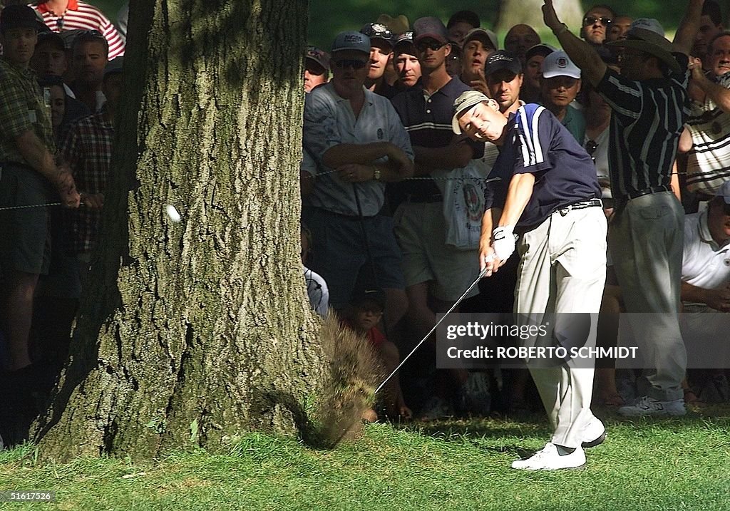 Sergio Garcia of Spain hits past a tree on the 16t