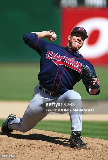 Cleveland Indians starting pitcher Bartolo Colon winds up for a pitch during the fifth inning against the Oakland Athletics 25 August, 1999 in...