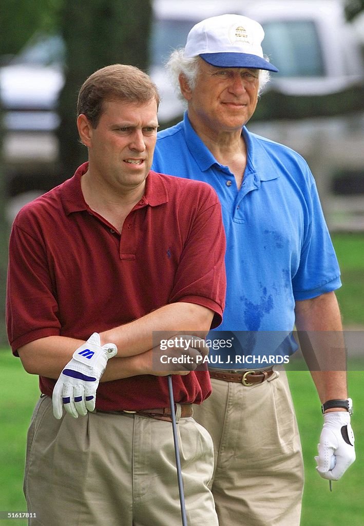 Britain's Prince Andrew (L) and Sir Evelyn Rothsch
